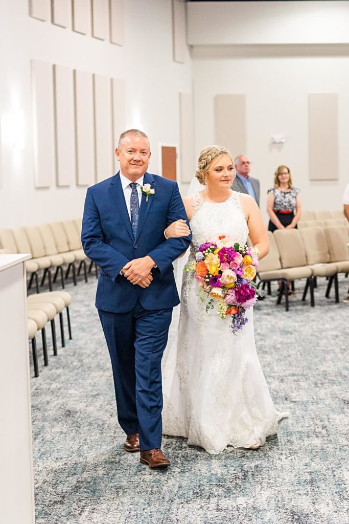 Bride walking down the aisle with her dad in Ohio Church wedding