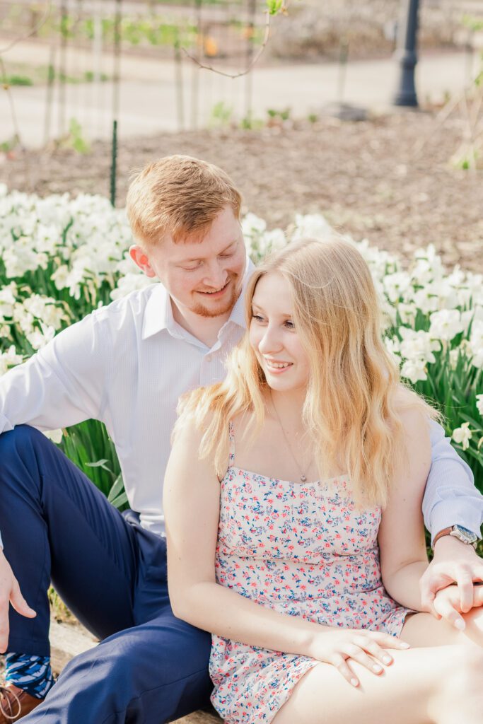 Franklin Park Conservatory Engagement Photo – A couple poses in front of the lush botanical gardens at Franklin Park Conservatory in Columbus, Ohio.