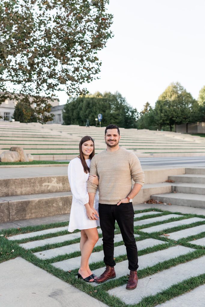 Downtown Columbus Engagement Photo on Scioto Mile – A couple walks through the Scioto Mile. One of the best engagement session location in Columbus. 